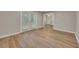 Bright, airy bedroom with wood floors, large windows, and access to back deck at 1922 Knipe Sw Dr, Marietta, GA 30064