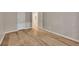A bright bedroom features hardwood floors, neutral walls, and white doors creating a welcoming atmosphere at 1922 Knipe Sw Dr, Marietta, GA 30064