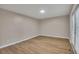 Spacious bedroom with wood flooring, neutral walls, and natural light from windows at 1922 Knipe Sw Dr, Marietta, GA 30064