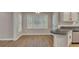 Bright breakfast nook with hardwood floors, large bay windows, and granite countertops in the kitchen at 1922 Knipe Sw Dr, Marietta, GA 30064