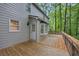 Charming deck next to home's bay window surrounded by lush greenery, offering a peaceful outdoor retreat at 1922 Knipe Sw Dr, Marietta, GA 30064