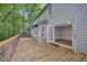 Wooden deck with access to the house, offering serene backyard views and outdoor living space at 1922 Knipe Sw Dr, Marietta, GA 30064