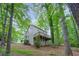 Home exterior showing a raised deck, siding, and wooded surroundings at 1922 Knipe Sw Dr, Marietta, GA 30064