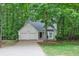Charming single-Gathering home with a two-car garage, surrounded by mature trees and landscaping at 1922 Knipe Sw Dr, Marietta, GA 30064