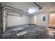 Spacious garage with a weathered floor and overhead door tracks, providing ample storage space at 1922 Knipe Sw Dr, Marietta, GA 30064