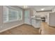 Charming kitchen features wood floors, white cabinets, stainless steel appliances and a large window at 1922 Knipe Sw Dr, Marietta, GA 30064