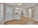 Bright kitchen with white cabinets, stainless appliances, eat-in bar, and access to back patio at 1922 Knipe Sw Dr, Marietta, GA 30064