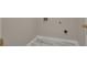 Laundry Room includes modern tile flooring with white walls, ready for appliances at 1922 Knipe Sw Dr, Marietta, GA 30064