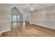 Inviting living room boasts hardwood flooring, a vaulted ceiling, and large windows for ample natural light at 1922 Knipe Sw Dr, Marietta, GA 30064