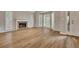 Spacious living room boasting wood floors, fireplace, and bay windows that flood the space with natural light at 1922 Knipe Sw Dr, Marietta, GA 30064