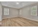 Large main bedroom with vaulted ceilings, wood flooring, and natural light from the windows at 1922 Knipe Sw Dr, Marietta, GA 30064