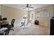 Bedroom featuring a ceiling fan, exercise equipment, and natural light at 1314 Durham Ter, Mcdonough, GA 30252