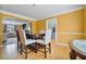 Elegant dining area featuring hardwood floors, neutral walls and a view to the living room at 1314 Durham Ter, Mcdonough, GA 30252
