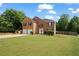 Lovely two-story brick home with a two-car garage, manicured lawn, and charming curb appeal at 1314 Durham Ter, Mcdonough, GA 30252