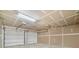 Spacious two car garage with bright lighting and new paint at 1314 Durham Ter, Mcdonough, GA 30252