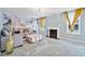 Inviting living room with a decorative wall, fireplace, neutral-toned furniture, and soft carpeting at 1314 Durham Ter, Mcdonough, GA 30252