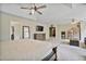 Spacious carpeted main bedroom with ceiling fans, large dresser and television at 1314 Durham Ter, Mcdonough, GA 30252
