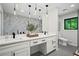 Modern bathroom with double vanity, large mirror, and tiled walls at 1749 Ridge Valley Nw Ct, Atlanta, GA 30327