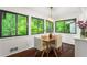 Dining room with table and four chairs and large windows with views of the trees at 1749 Ridge Valley Nw Ct, Atlanta, GA 30327