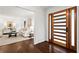 Inviting foyer with a modern wood door, leading to a living room with stylish furnishings at 1749 Ridge Valley Nw Ct, Atlanta, GA 30327