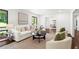 Cozy living room with hardwood floors, white sofa, comfortable chairs, and an open layout at 1749 Ridge Valley Nw Ct, Atlanta, GA 30327