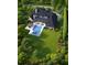 Aerial view of a house featuring a landscaped yard, pool, and outdoor living spaces at 260 Mayfield Rd, Alpharetta, GA 30009