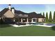 Luxury home featuring a backyard pool and entertainment area at 260 Mayfield Rd, Alpharetta, GA 30009