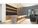 Stylish bar area with marble countertops, designer stools, accent lighting and modern cabinets at 260 Mayfield Rd, Alpharetta, GA 30009