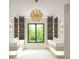 Bright bathroom features dual vanities, statement lighting, a large window and built in storage at 260 Mayfield Rd, Alpharetta, GA 30009