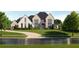 Stunning new construction home with modern design, pristine landscaping, and a welcoming walkway at 260 Mayfield Rd, Alpharetta, GA 30009