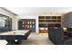 Entertaining game room with pool table, bar area, modern lighting and theater seating at 260 Mayfield Rd, Alpharetta, GA 30009