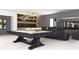 Game room featuring a pool table, home theater seating, and a bar area for entertaining guests at 260 Mayfield Rd, Alpharetta, GA 30009