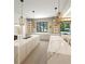 Expansive kitchen with marble countertops, double islands, and seamless connection to outdoor space at 260 Mayfield Rd, Alpharetta, GA 30009