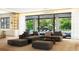 Open-concept living room with modern furnishings, stylish lighting, and seamless access to outdoor pool at 260 Mayfield Rd, Alpharetta, GA 30009