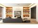 Stylish living room boasting a comfortable sofa, custom shelving with accent lighting, and a modern fireplace at 260 Mayfield Rd, Alpharetta, GA 30009
