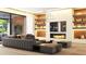 Modern living room featuring a plush sofa, fireplace, custom shelving, and a large sliding glass door at 260 Mayfield Rd, Alpharetta, GA 30009