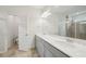 Bathroom featuring double sink vanity with modern fixtures, tile floors, and glass shower at 302 Braswell Ct, Woodstock, GA 30188