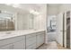 Bathroom featuring double sink vanity with modern fixtures, tile floors, and glass shower at 302 Braswell Ct, Woodstock, GA 30188