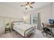 Modern bedroom with a study desk and chair, perfect for work or study at 302 Braswell Ct, Woodstock, GA 30188