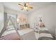 Playful bedroom featuring a teepee tent, twin bed and natural light at 302 Braswell Ct, Woodstock, GA 30188