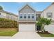 Charming two-story townhome with a two-car garage and professionally landscaped front yard at 302 Braswell Ct, Woodstock, GA 30188