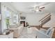 Cozy living room featuring a fireplace, comfortable seating, and hardwood floors at 302 Braswell Ct, Woodstock, GA 30188