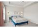 Bright, spacious main bedroom featuring tray ceilings, paneling, and stylish lighting at 302 Braswell Ct, Woodstock, GA 30188
