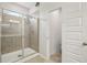 Modern tiled shower with glass enclosure, perfect for a spa-like experience at 302 Braswell Ct, Woodstock, GA 30188