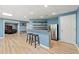 Finished basement with wet bar, recessed lighting, and wood flooring at 3052 Fleet Sw St, Marietta, GA 30064