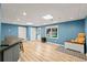Finished basement with wood flooring, recessed lighting, and a large window at 3052 Fleet Sw St, Marietta, GA 30064