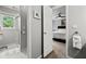 Bright bathroom featuring tiled flooring, and a glass enclosed shower stall at 3052 Fleet Sw St, Marietta, GA 30064
