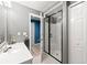 Bathroom featuring updated vanity, glass shower, and white doors at 3052 Fleet Sw St, Marietta, GA 30064