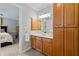 Bathroom featuring wooden cabinets, a large mirror, and neutral wall color at 3052 Fleet Sw St, Marietta, GA 30064