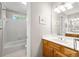 Bright bathroom with double sink vanity, tub, and natural light from window at 3052 Fleet Sw St, Marietta, GA 30064